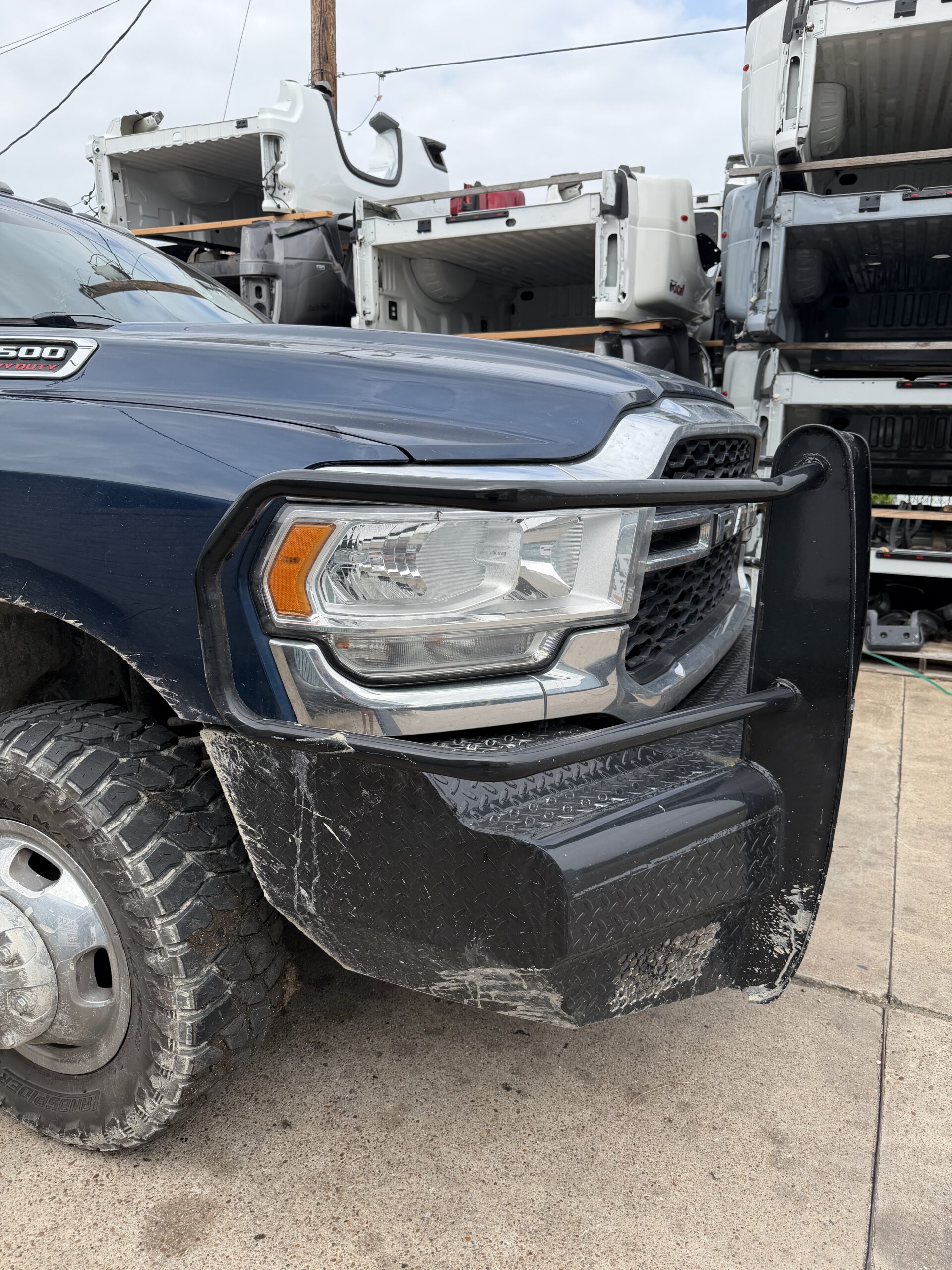 Aftermarket steel front replacement bumper installed on Ram truck at Texas Truck Parts