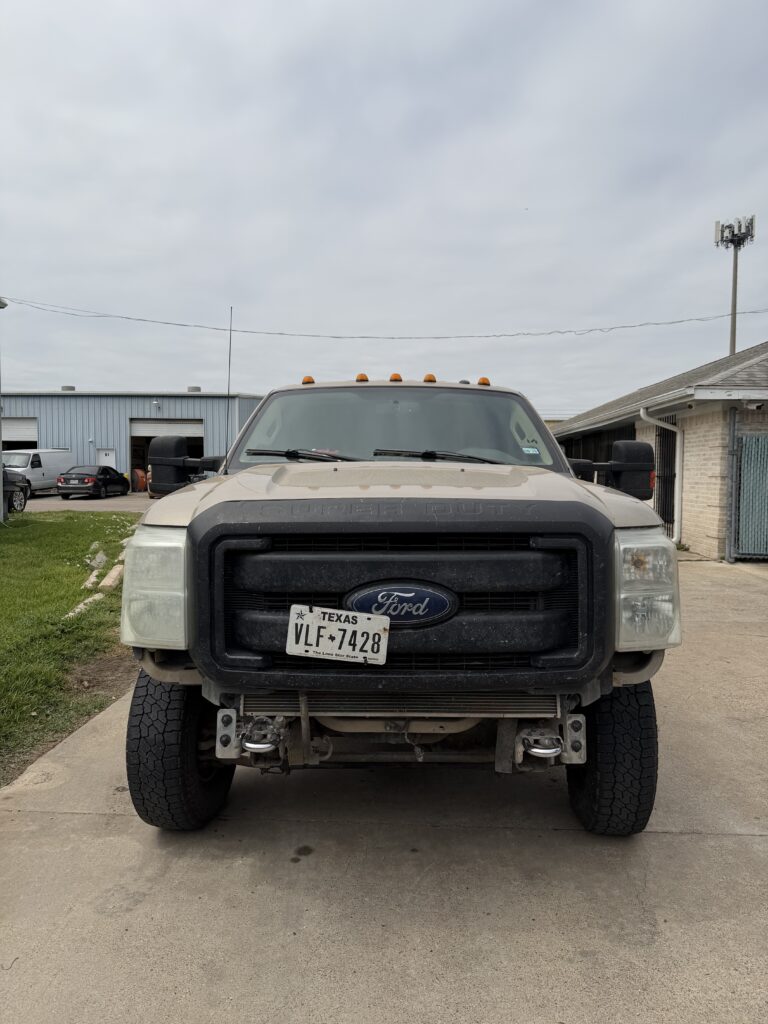 Ford Super Duty with aftermarket steel front replacement bumper installed