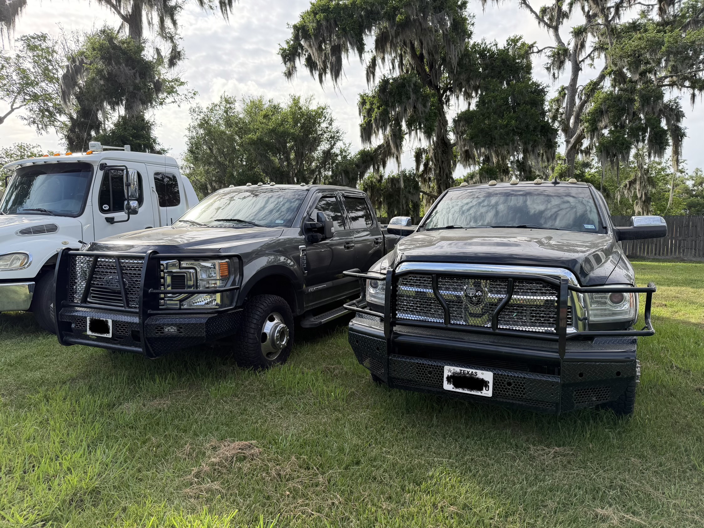 Ranch Hand Summit and One Source aftermarket front replacement bumpers side by side on Ford F350 and Ram 3500