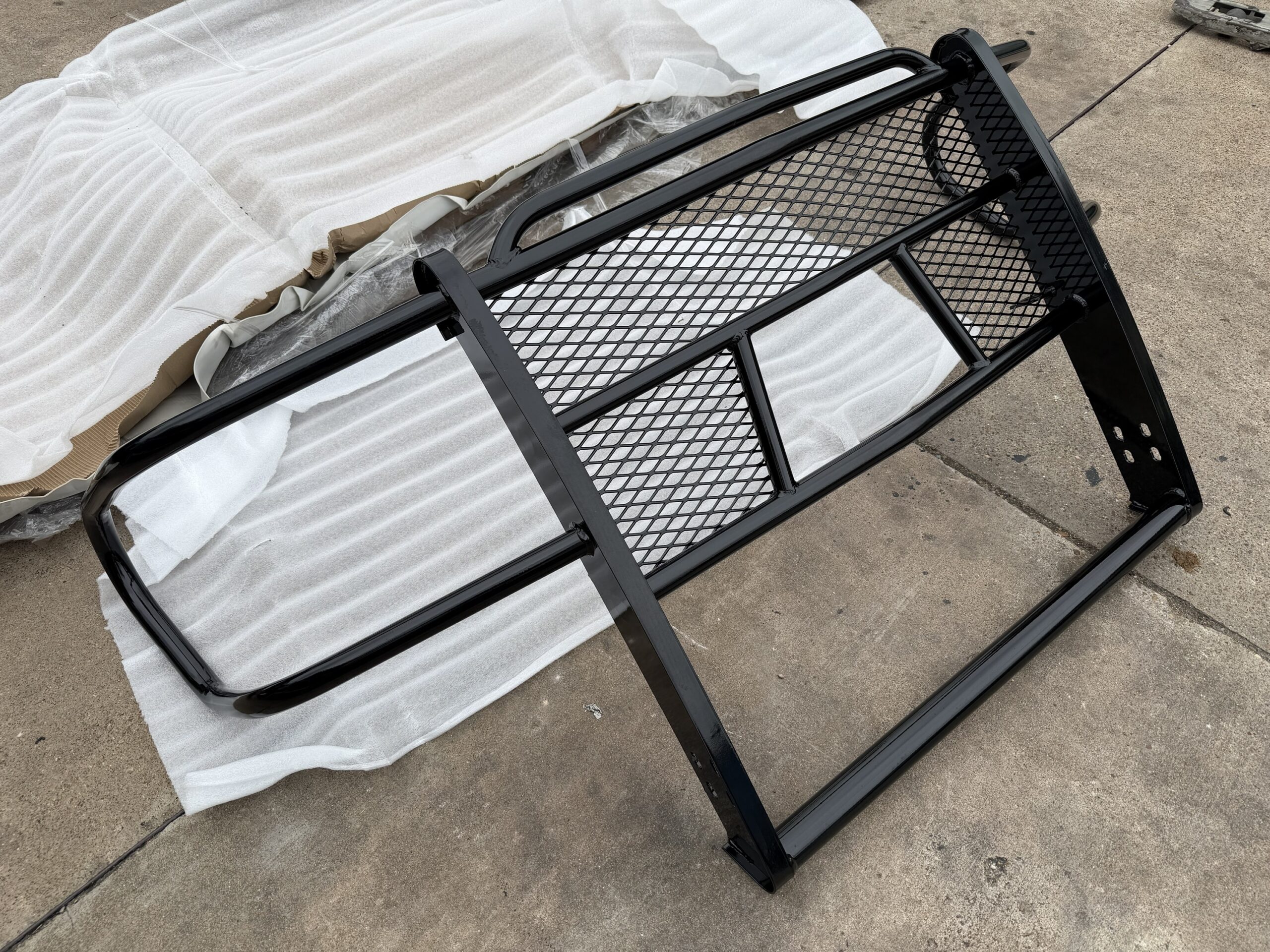 Tough Country GMC grill guard — bracket detail