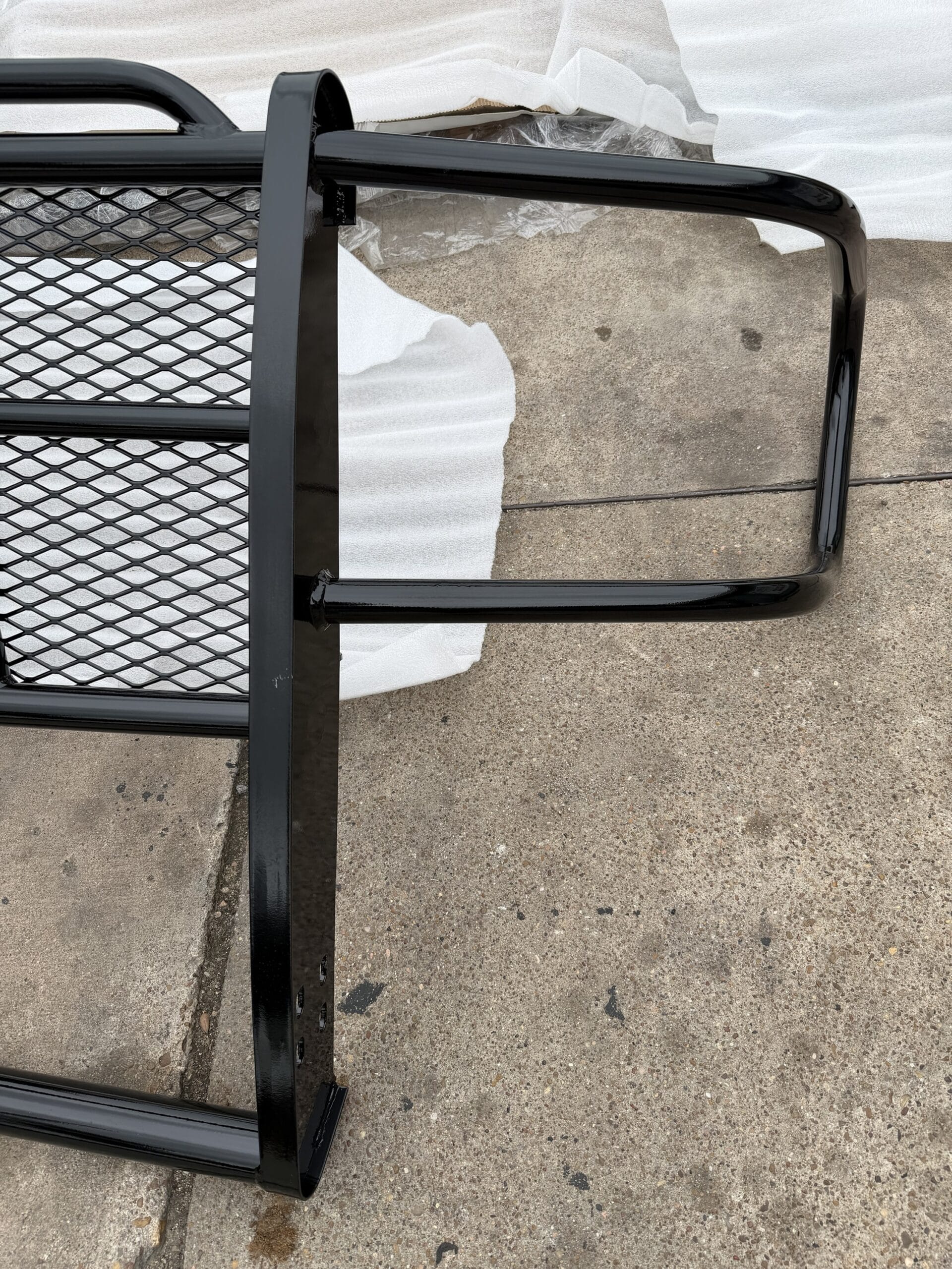 Tough Country GMC grill guard — mounting hardware